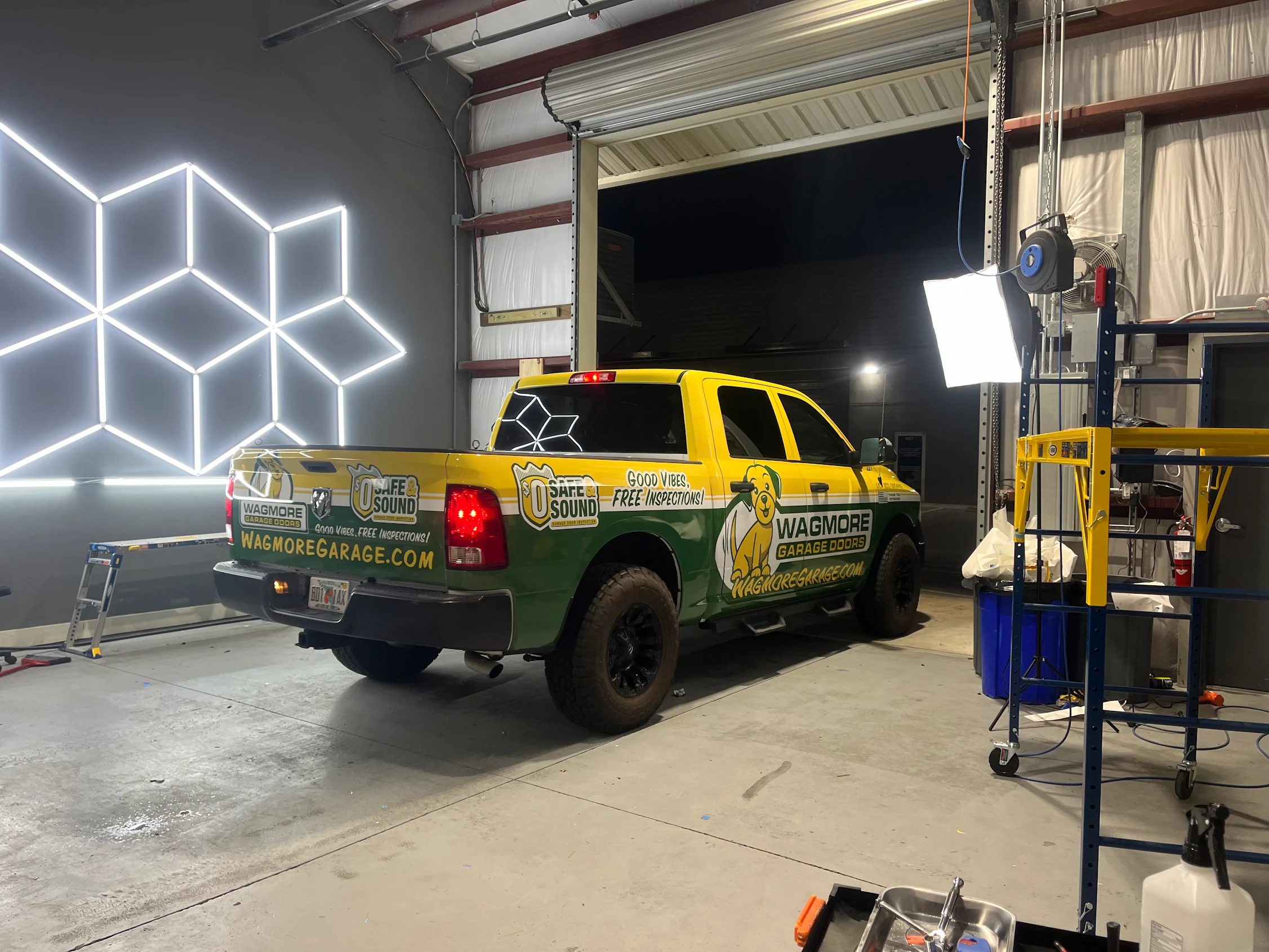 Wagmore Garage Doors branded company truck inside the Luna Labs shop